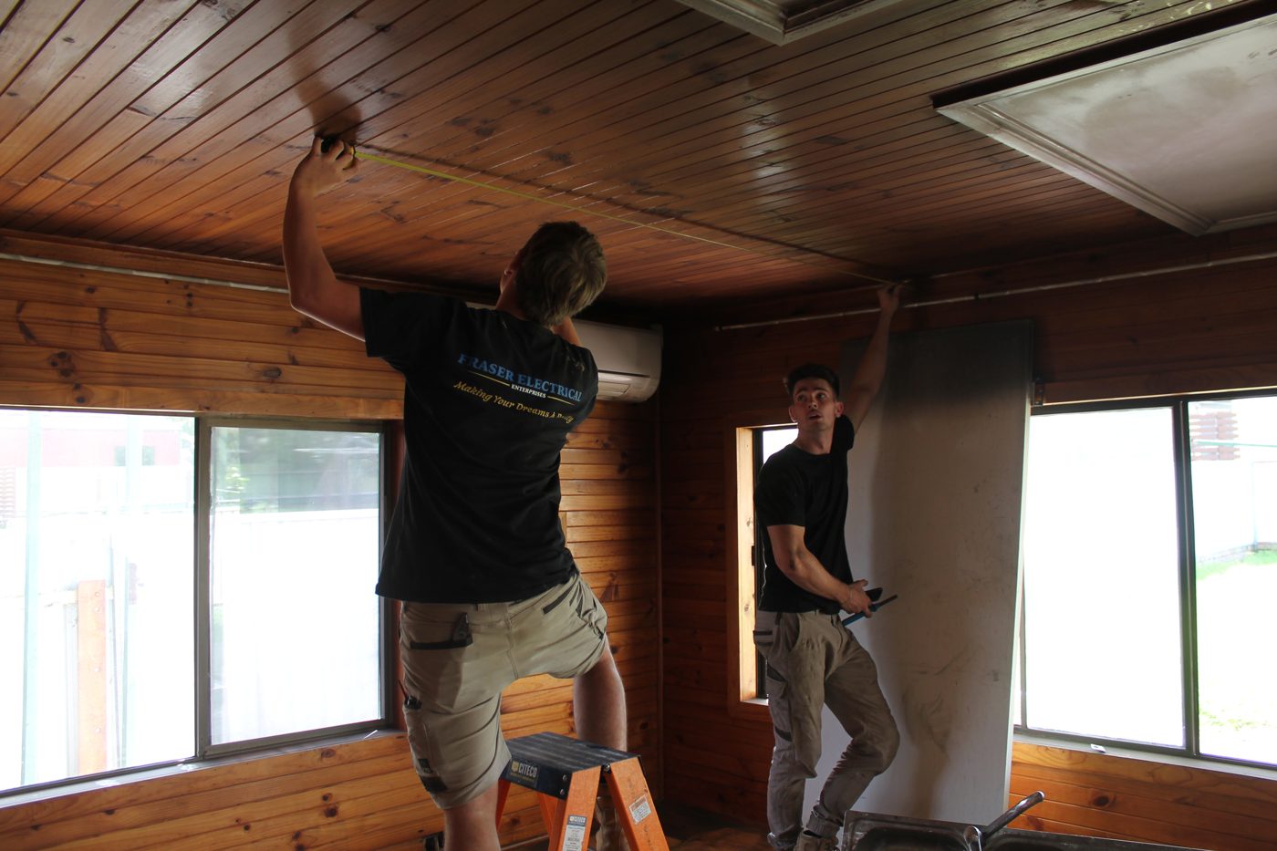 Two Fraser Electrical technicians on site together